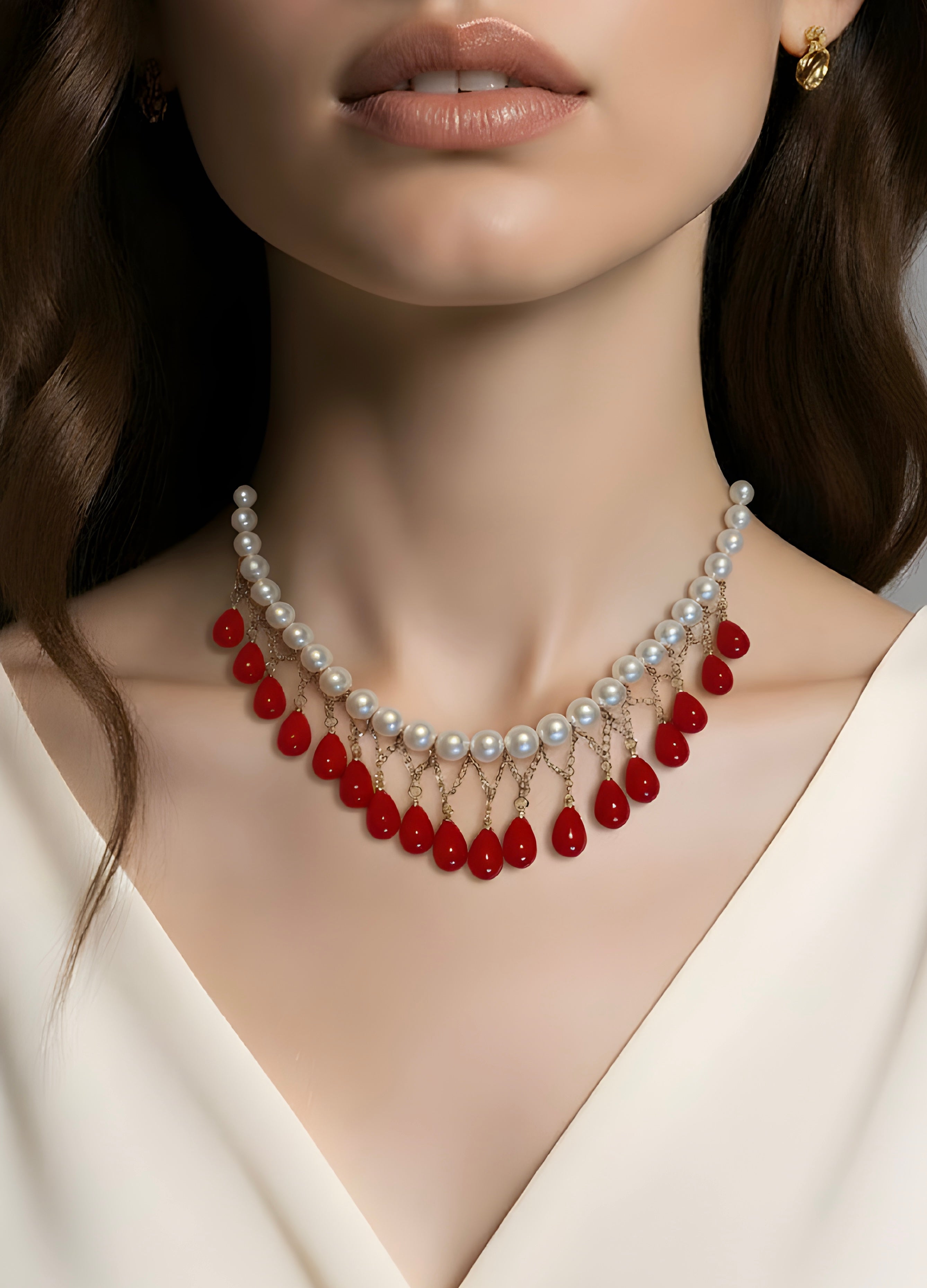 Classic strand of luminous white pearls paired with cascading red teardrop charms handmade customized necklace