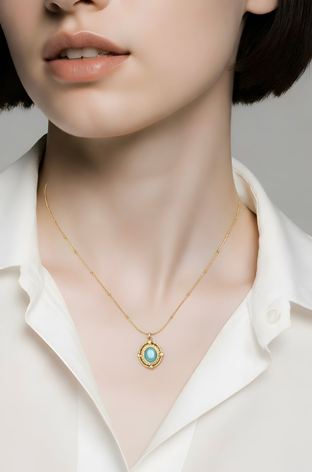 Oval cabochon-cut gemstone pendant